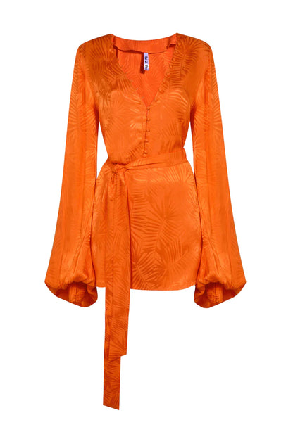 A women's orange blouse with a long sleeve.