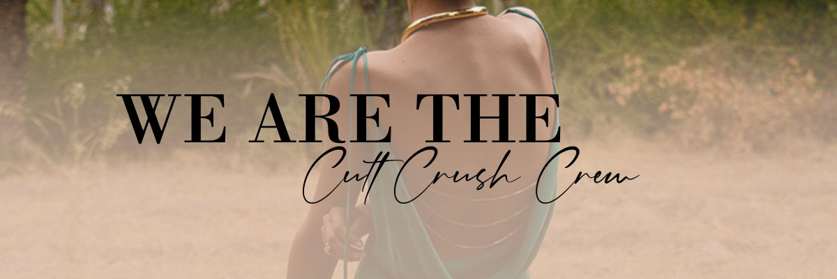 A woman in a backless luxurious dress with Cult Crush community.