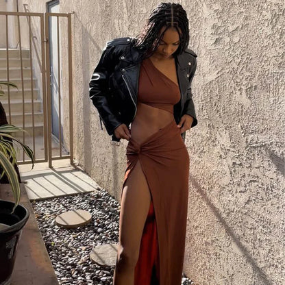 A woman is posing in a Caterina Cocoa Cut Out Maxi Dress.