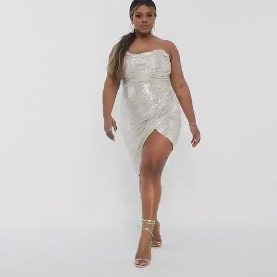 A woman wearing a silver sequin dress.updated#gid://shopify/Video/21599477923910#video_id