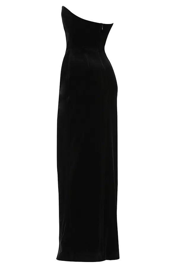 The back view of a black velvet dress.