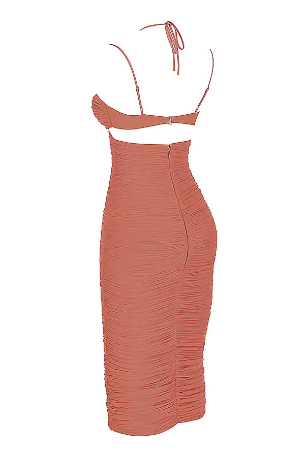 The back view of an orange ruched midi dress.
