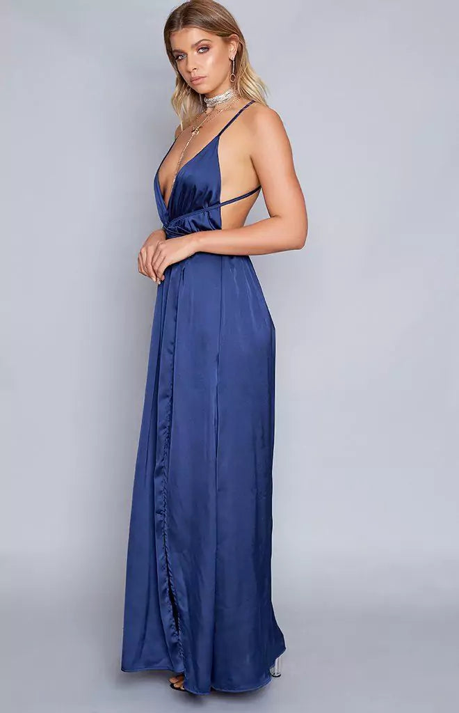 The model is wearing a blue midnight maxi dress.