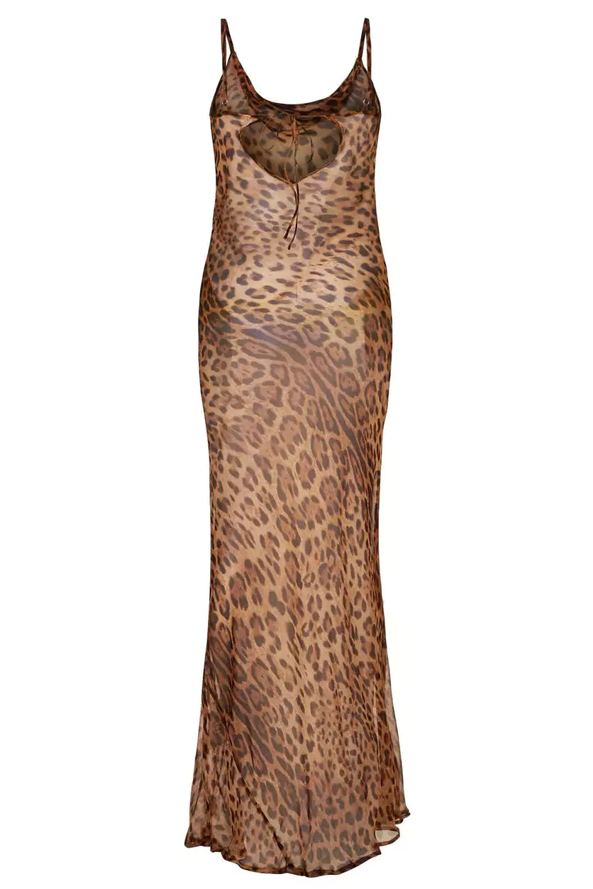A woman wearing a leopard print slip dress.