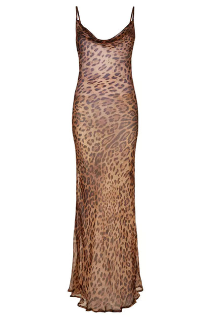 A woman wearing a leopard print slip dress.