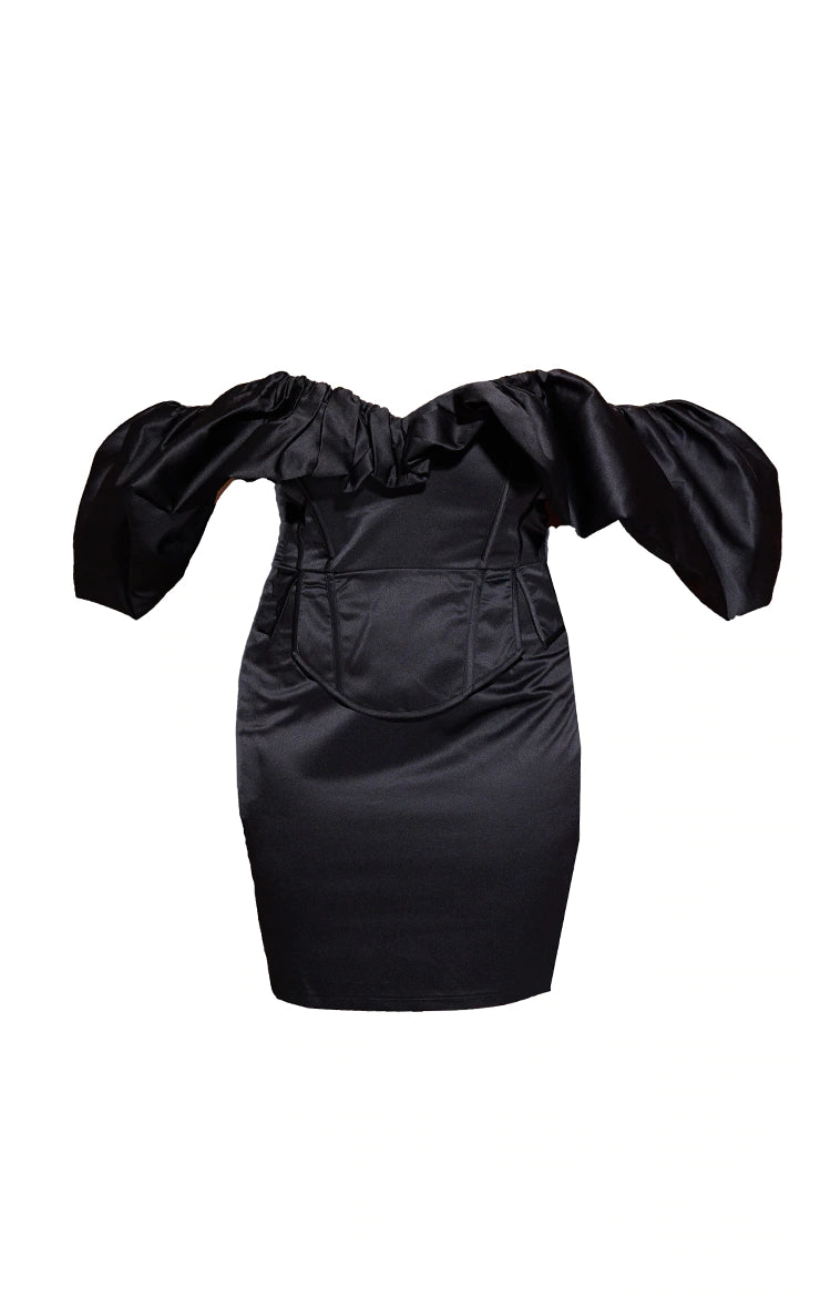 A black off the shoulder dress with ruffled sleeves.