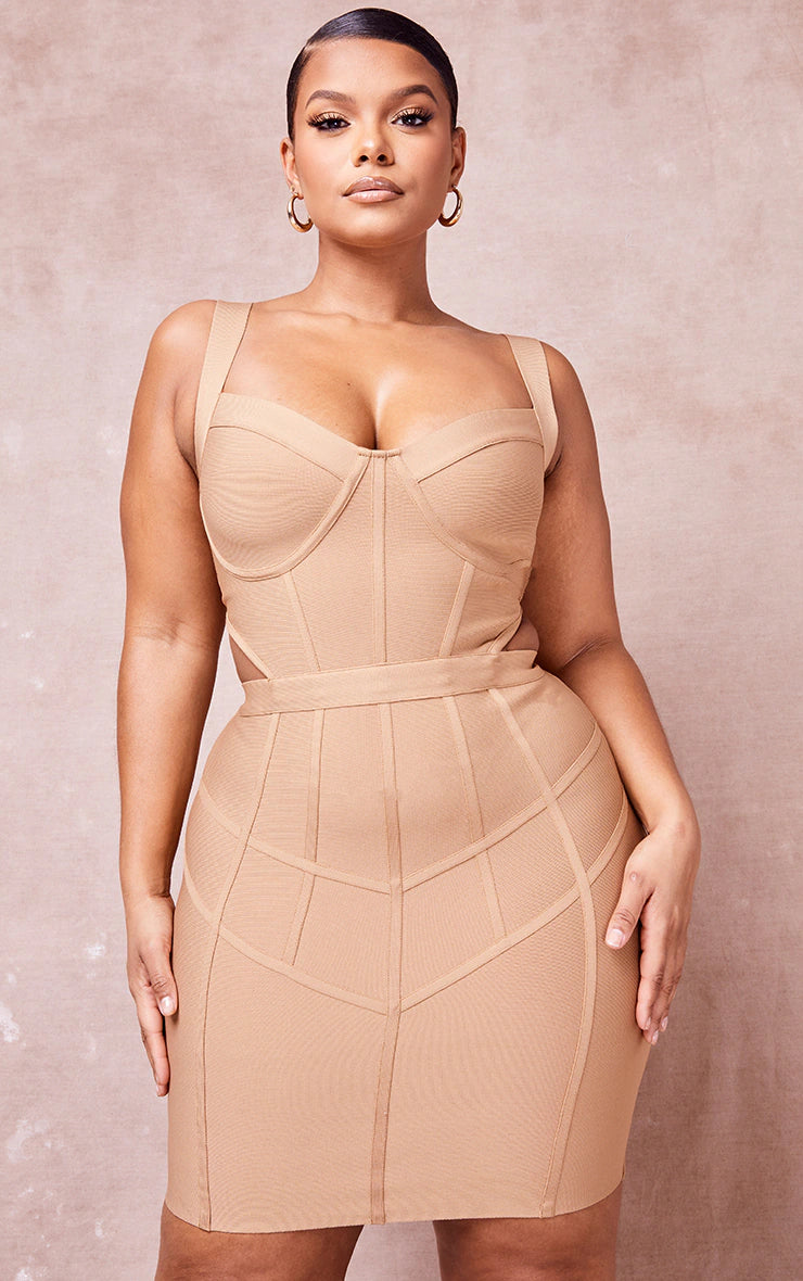 A model is wearing Abena stone bandage cut out dress. Perfect plus size dress to rent for your next special occasion on Cult Crush.