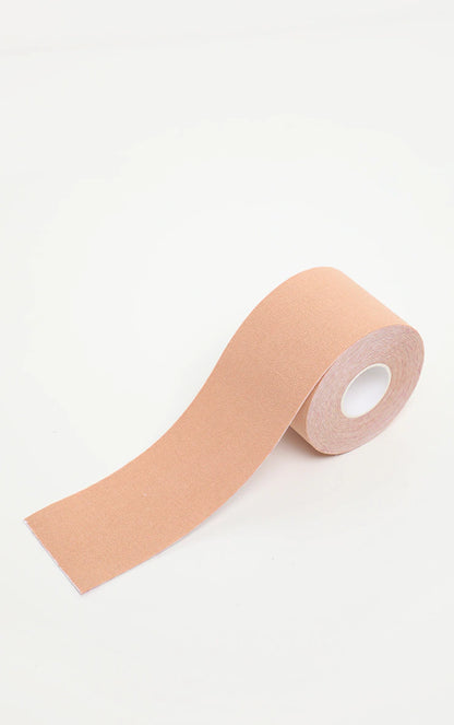 A roll of booby tape on a white surface.